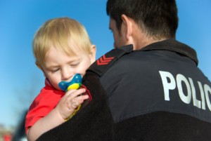 Police holding child
