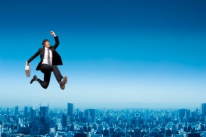 Businessman jumping in the air, land job
